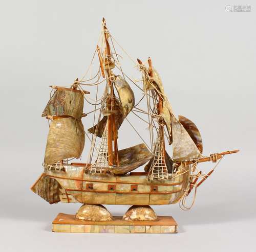 A MOTHER-OF-PEARL AND WOODEN MODEL OF THE ENDEAVOUR. 12ins long.