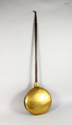 AN 18TH CENTURY WROUGHT IRON AND BRASS BED WARMING PAN. 45ins long.