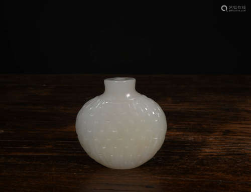 A Chinese Carved White Jade Snuff Bottle