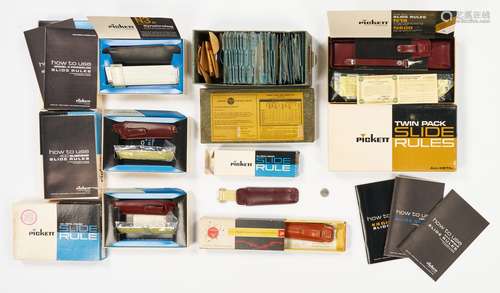 7 Pickett Boxed Slide Rules, 1 Dealer's Kit