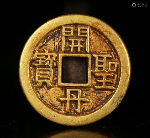 A GOLD COIN WITH PATTERN