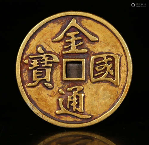 A GOLD COIN WITH PATTERN