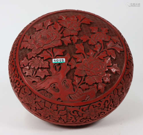 A RED LACQUER BOX WITH FLOWERS CARVING