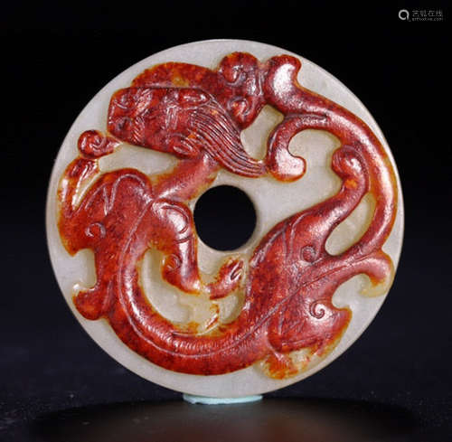 AN OLD HETIAN JADE BI WITH DRAGON PATTERN