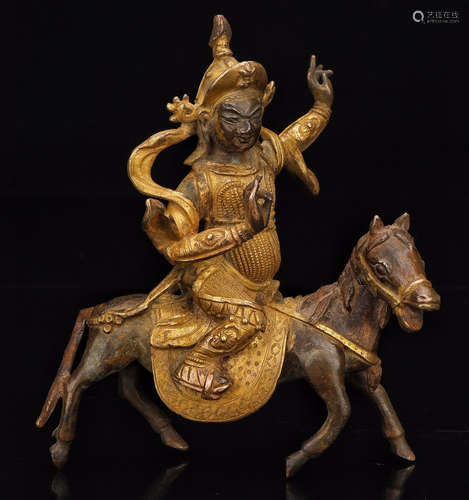 A GILT BRONZE FIGURE