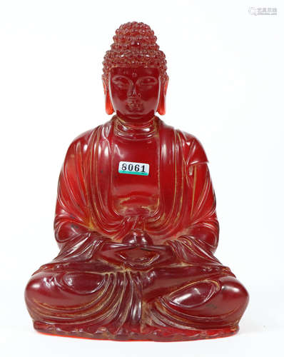 AN AMBER GAUTAMA BUDDHA