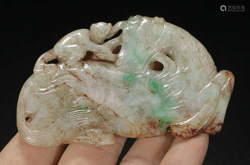 A JADEITE PENDANT WITH CARVING