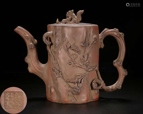 A ZISHA POT CARVED WITH SQUIRREL AND GRAPES