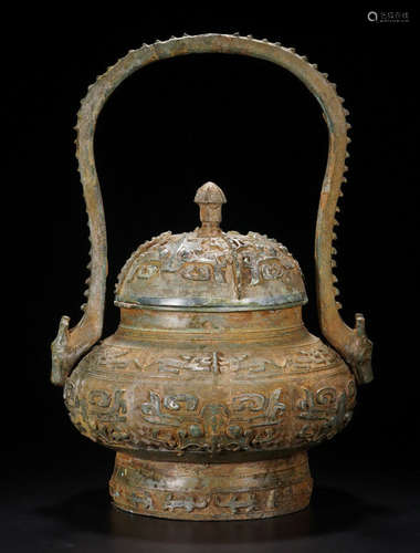 A BRONZE POT WITH PATTERN