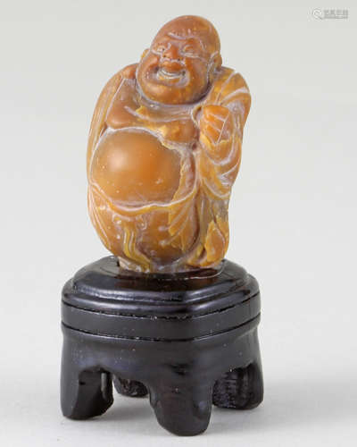 A SOAPSTONE CARVED MAITREYA BUDDHA