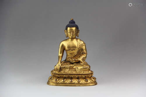 A CHINESE GILD COPPER STATUE OF SAKYAMUNI