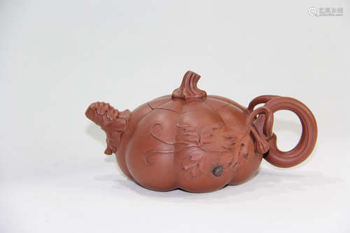 A CHINESE PUMPKIN SHAPED PURPLE SAND TEAPOT