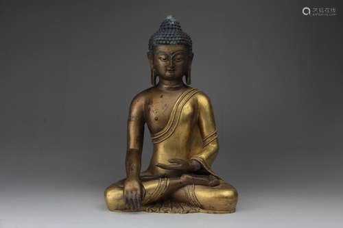 A CHINESE GILD COPPER STATUE OF SAKYAMUNI