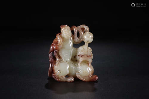 A Chinese Carved Hetian Jade Beast Ornament