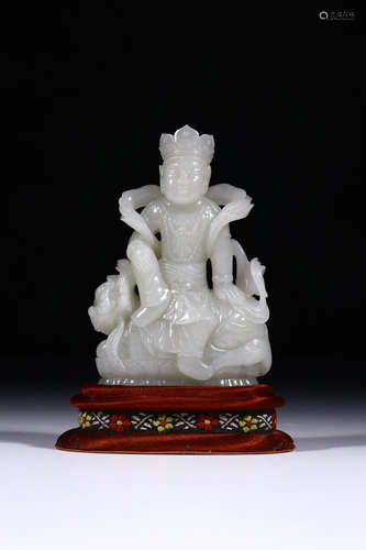 A CHINESE CARVED HETIAN JADE STATUE OF MANJUSRI BODHISATTVA