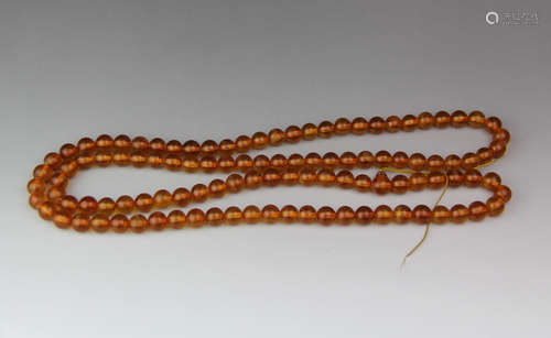 A CHINESE AMBER BUDDHA BEADS STRING, 108PCS