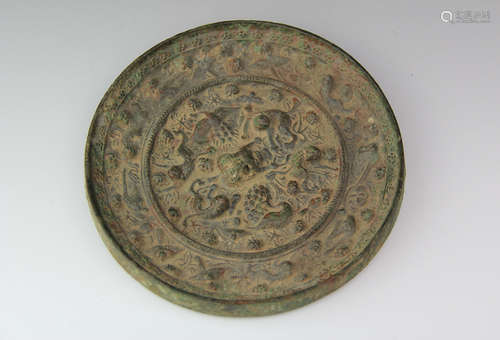 A CHINESE BEAST HANDLE BRONZE MIRROR