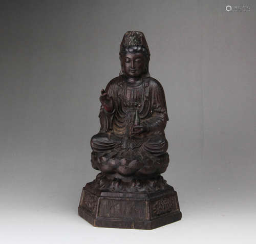 A CHINESE CARVED ROSEWOOD GUANYIN STATUE