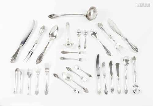 A twelve cover cutlery setPortuguese silverEngraved and raised handles of volute and wingle