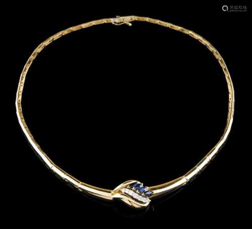 A necklaceGoldSemi-rigid set with 4 navette cut sapphires and 7 brilliant cut diamonds