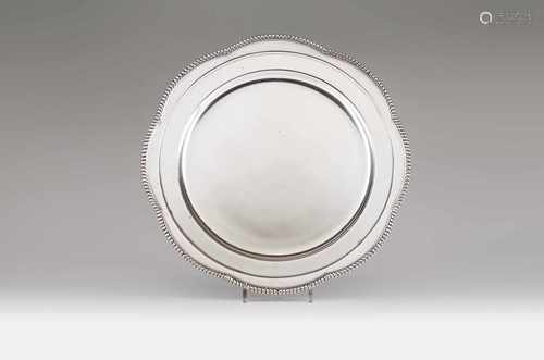 A scalloped charger, MANUEL ALCINOPortuguese silverFluted rimPorto assay mark (1938-198