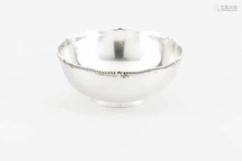 A drip bowlPortuguese silverPlain body of undulating lip and gadrooned and foliage frieze