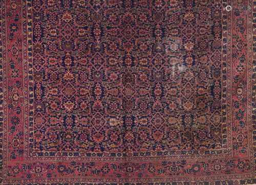 A Malayer rug, IranWool and cotton of geometric pattern in bordeaux, blue and beige shades3