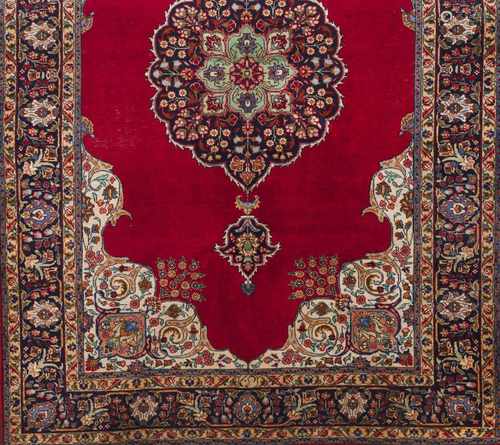 A Tabriz rug, IranWool and cotton of geometric pattern in bordeaux, blue and beige shades30