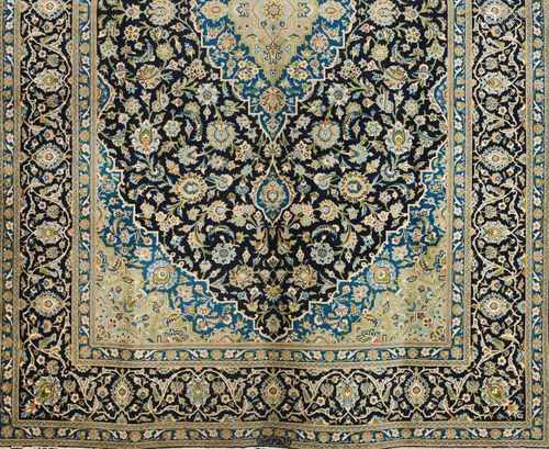 A Kashan rug, IranWool and cotton of geometric pattern in blue, beige and green shades340x2