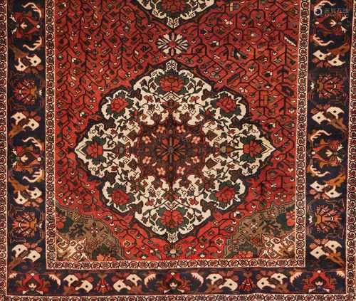 An Abadeh rug, IranWool and cotton of geometric pattern in bordeaux, blue and beige shades3