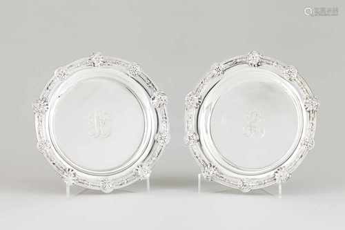 A pair of salversFrench silverPlain monogrammed centre and classical masks and foliage lip