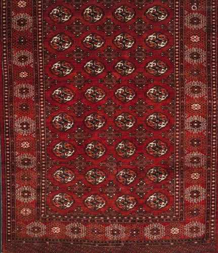 A Bukhara rug, IranWool and cotton of geometric pattern in bordeaux and beige shades225x155