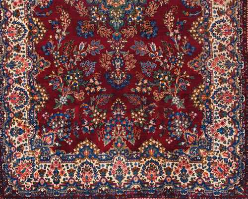 A Kerman rug, IranWool and cotton, of floral pattern in bordeaux, blue and beige355x222 cm