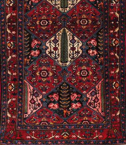 A Bakhtiari rug, IranWool and cotton, of geometric pattern in bordeaux, blue and beige300x1