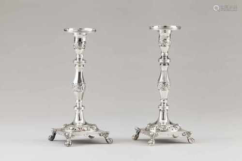 A pair of candle standsPortuguese silverTurned and faceted shaft engraved with flower bands