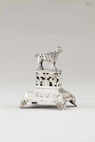 A toothpick holderSilver, 19th centuryA sheared poodle sculpture on a pierced and engraved