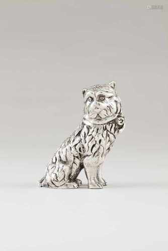 A catPortuguese silverRaised and engraved sculpture depicting a seated cat with bow collar