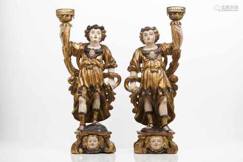 A pair of angels candleholdersCarved, gilt and polychrome wooden sculpturesPortugal, 18th c