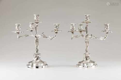 A pair of late 19th, early 20th century Portuguese silver candelabraChiselled in the Louis XV m