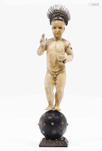 The Child Jesus Salvator MundiHispanic-Philippine ivory sculptureStanding on a polychrome w