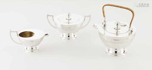 An unusual Art Deco tea setPortuguese silverHalf spherical body of geometric motifs engrave