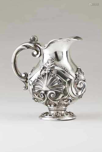 A jugPortuguese silverRaised and chiselled decoration of foliage, winglets and shell motifs