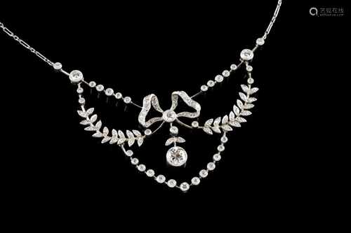 A necklaceGold and platinumRomantic era decoration of bow and flowers set with brilliant cu