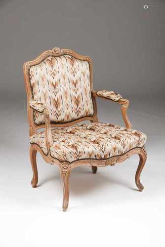 A Louis XV fauteuil à la reineCarved decoration of floral and foliage motifsTextile upholst