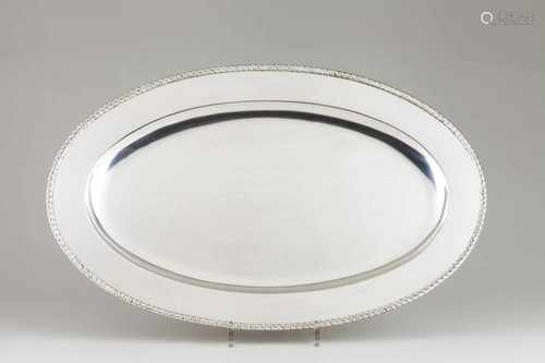 An oval serving dishPortuguese silverPlain base of gadrooned friezeLisbon hallmark, Eag