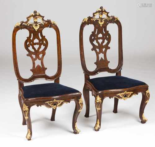 A pair of D.José chairsWalnutPart carved and gilt crest, apron and legsScalloped and pi