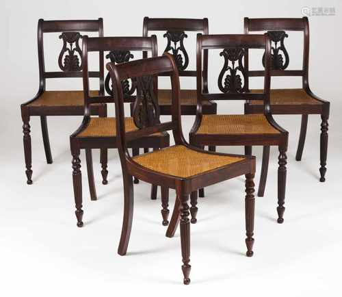 A set of six chairsRosewoodPierced backs, carved decoration and caned seatsPortugal, 19