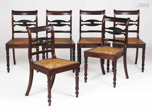 A set of six chairsRosewoodPierced backs, carved decoration and caned seatsPortugal, 19