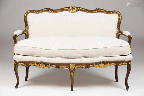 A D. José setteeBeechFloral and foliage motifs carved and gilt decorationFabric upholst