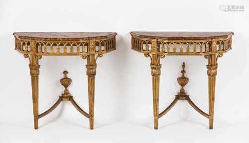 A pair of Louis XV consolesCarved, pierced and gilt wood with foliage motifs and urnsFrance